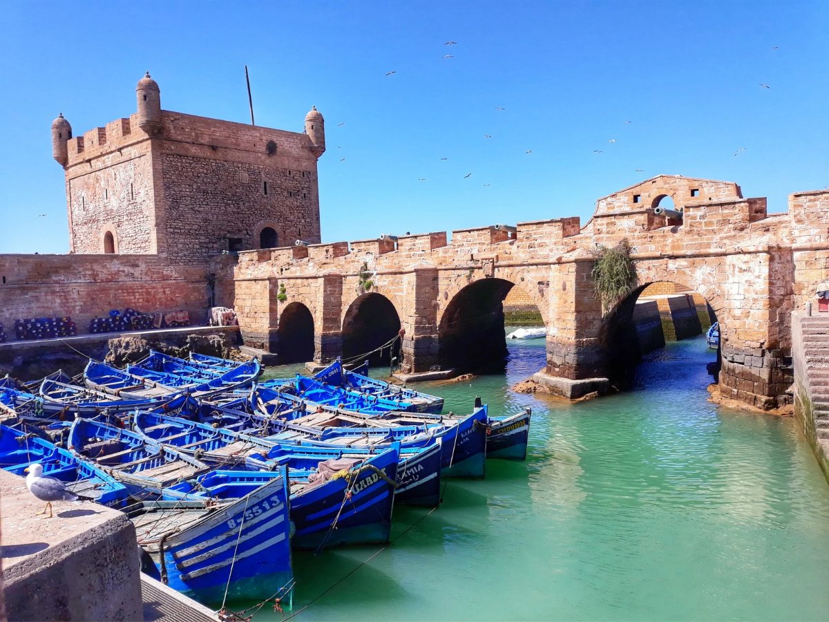 Essaouira harbour — the Skala fortress, stone ramparts and blue fishing boats