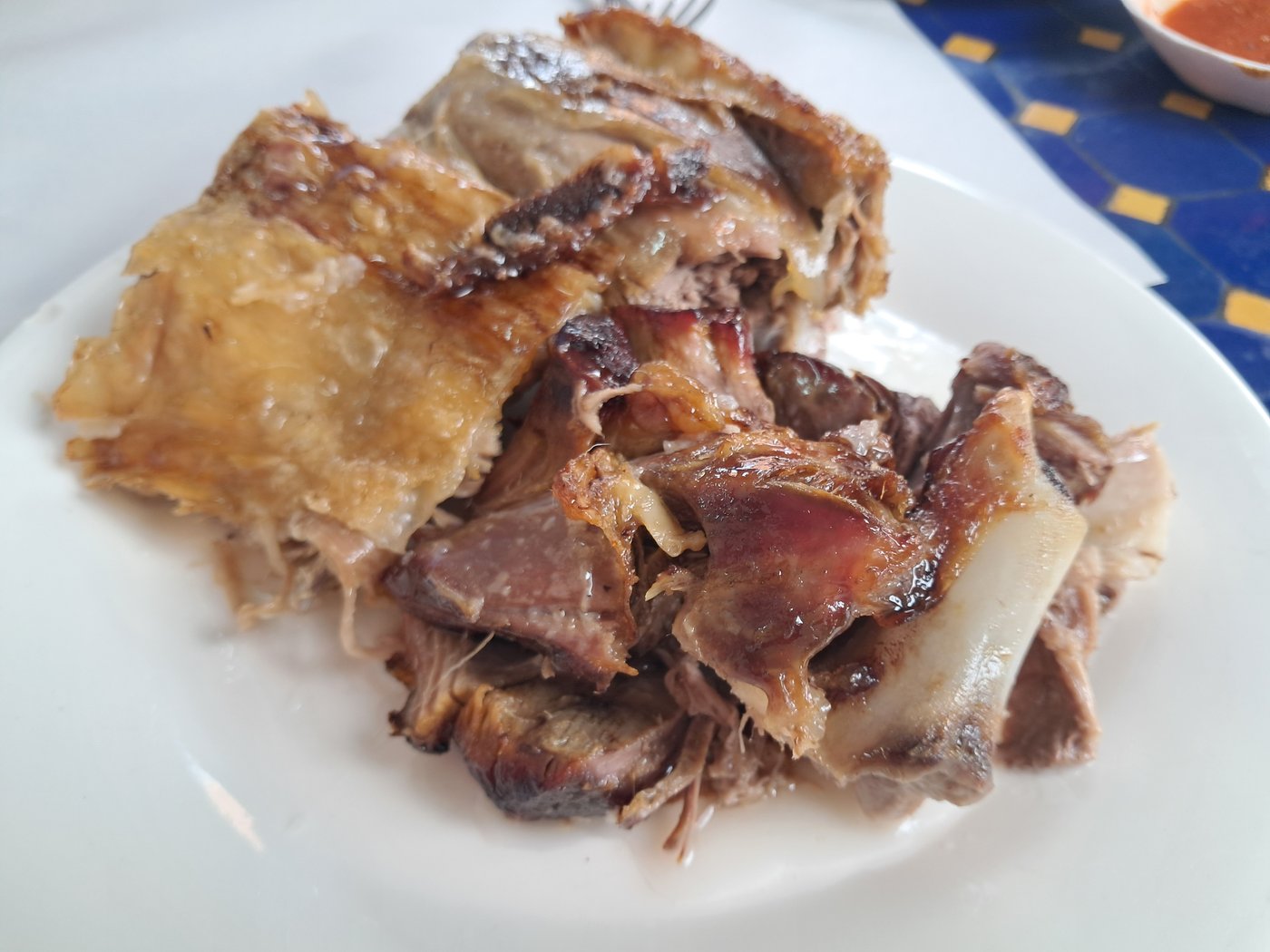 Mechoui lamb at Chez Lahmine, Marrakesh — crisp-skinned, cooked in its own juices
